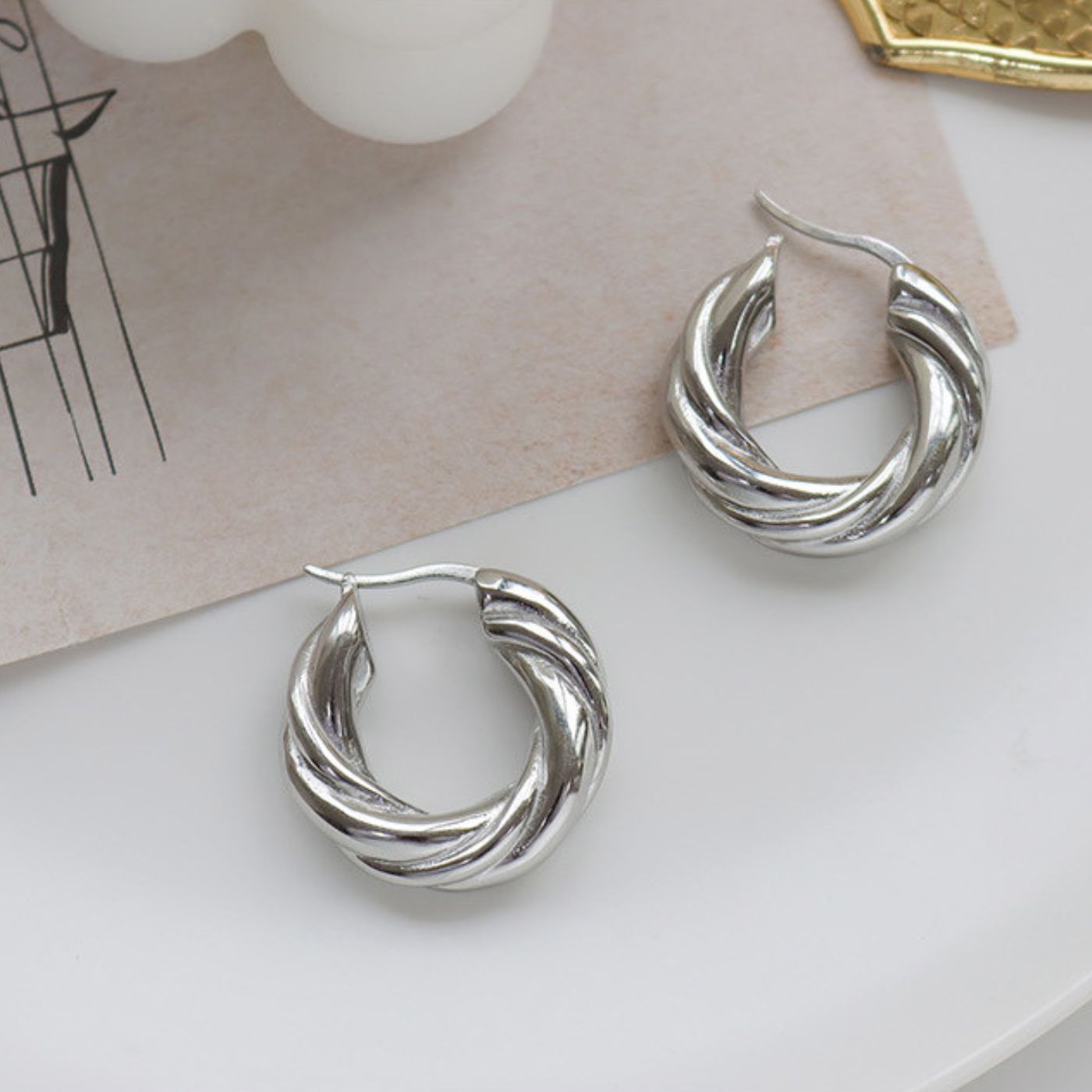 Silver-tone sculptural hoop earrings