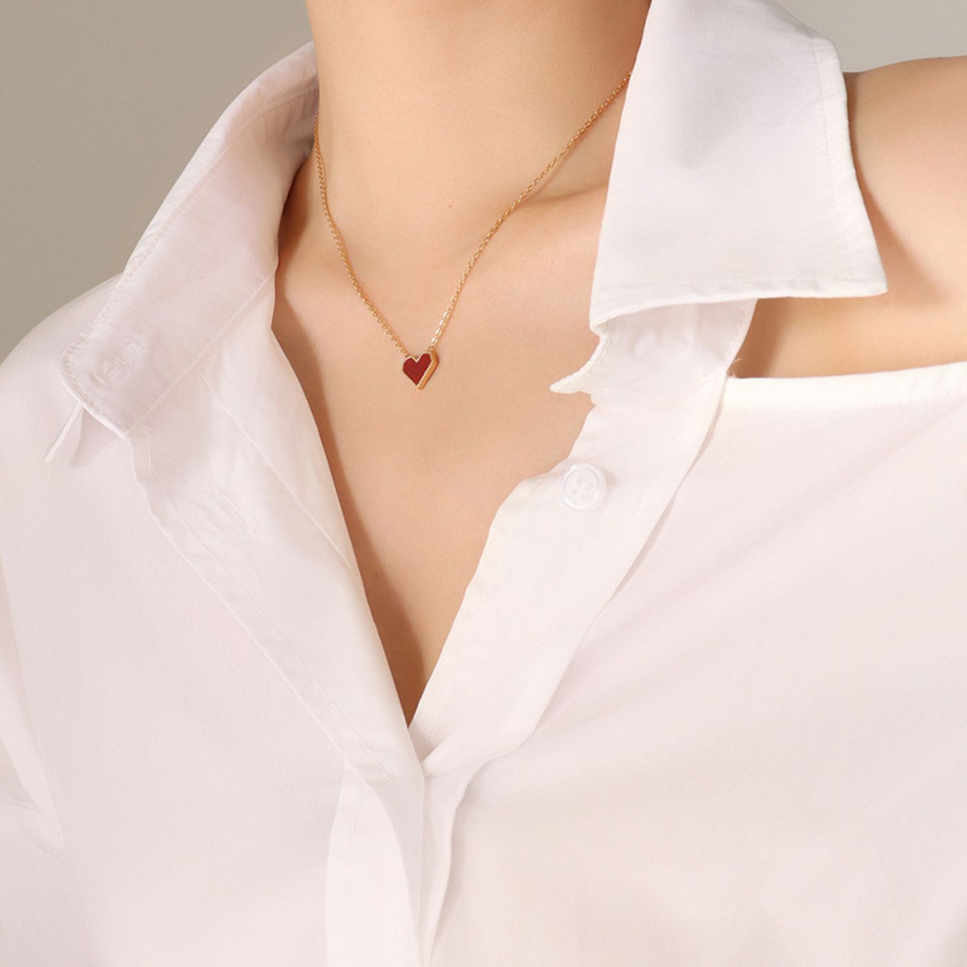 Gold-rimmed red heart necklace