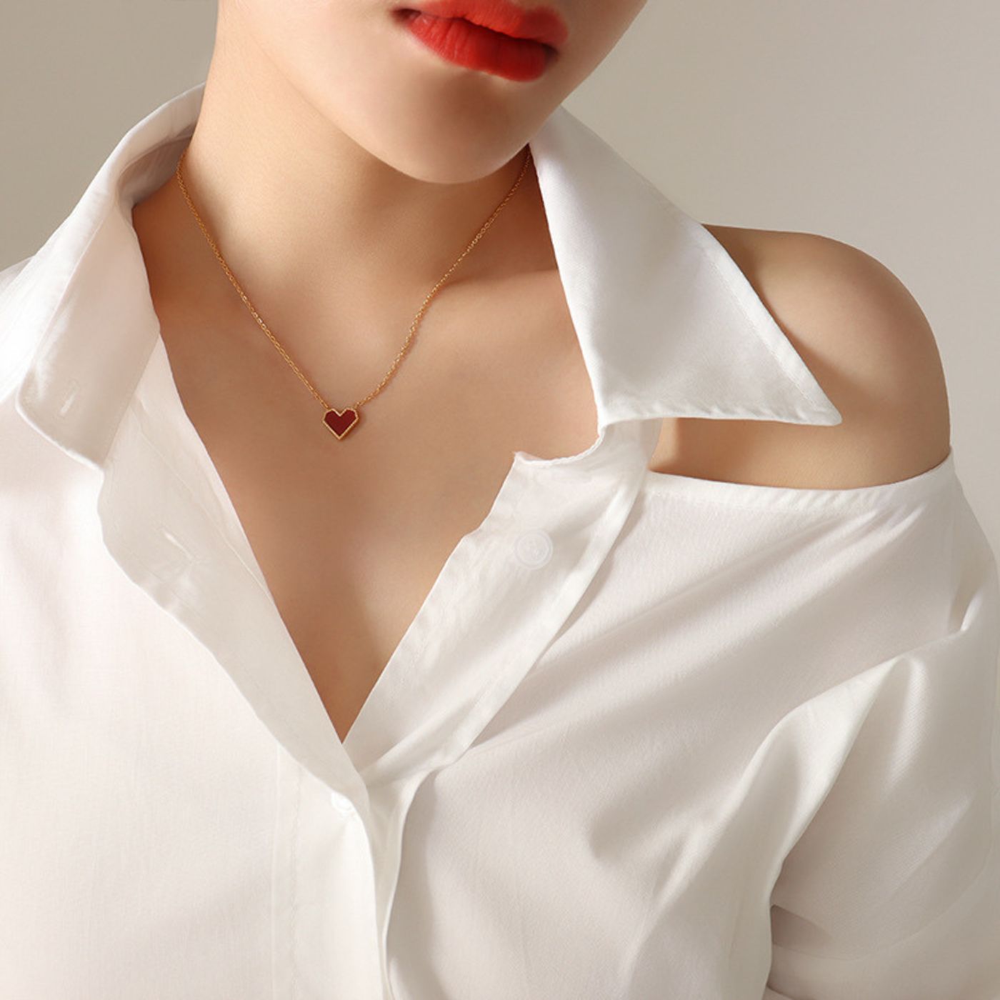 Gold-rimmed red heart necklace