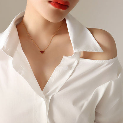 Gold-rimmed red heart necklace