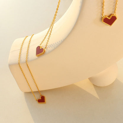 Gold-rimmed red heart necklace