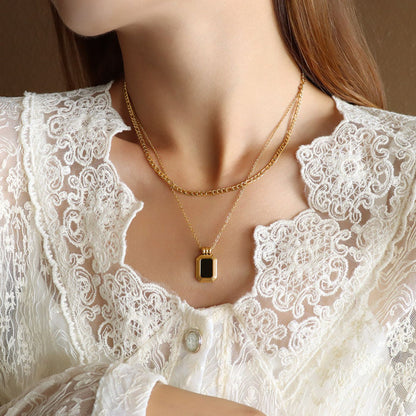 Double strand black and gold necklace